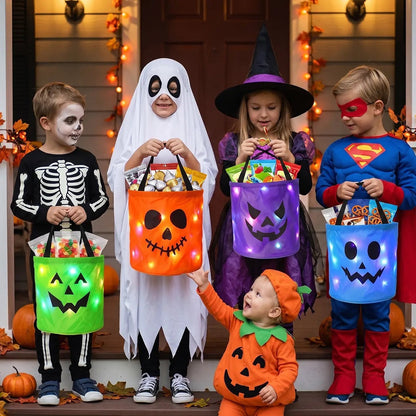 Kids trick-or-treating with glowing LED pumpkin candy buckets