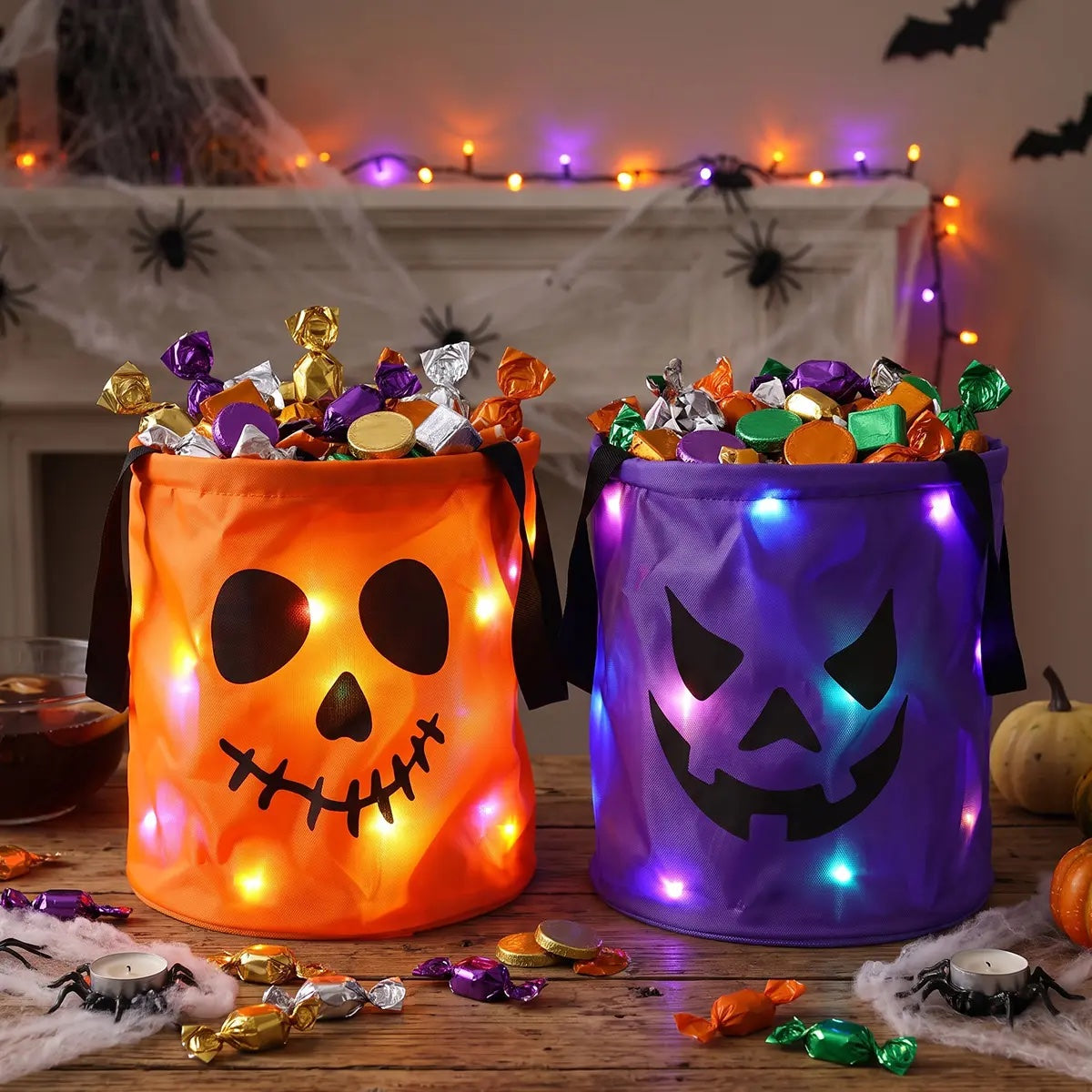 Orange and purple LED Halloween candy buckets side by side